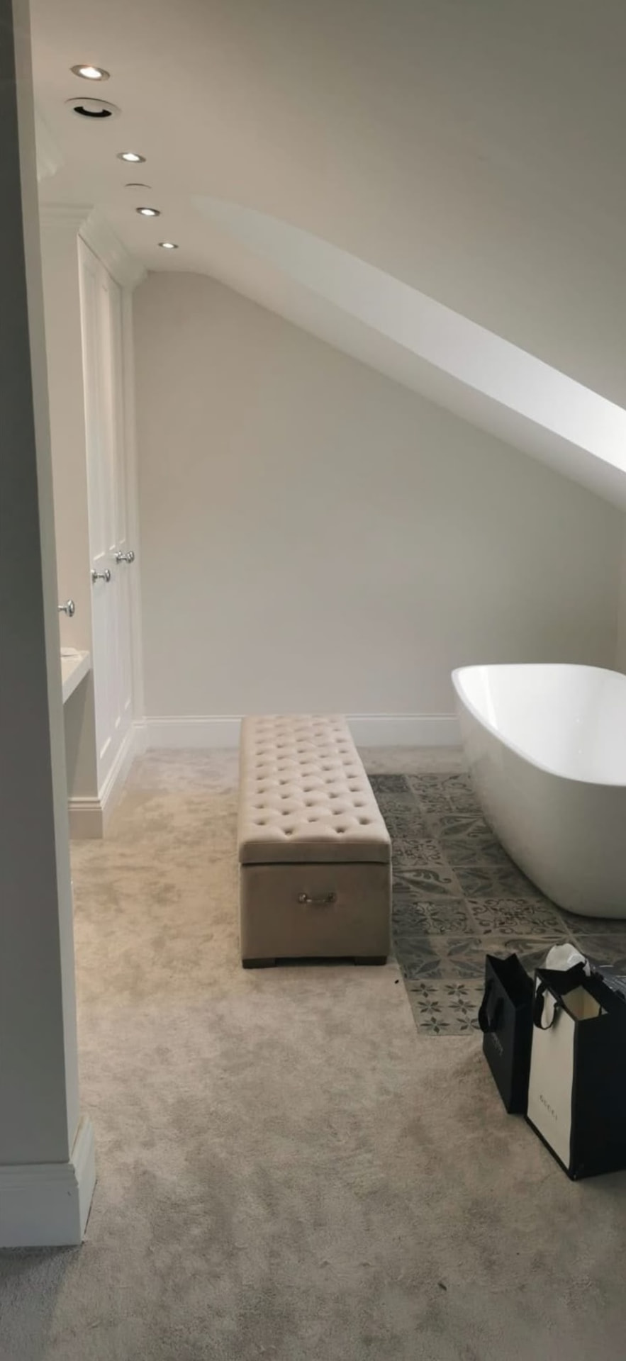 Sloped attic bathroom ceiling repaired and finished smooth in a Glasgow home