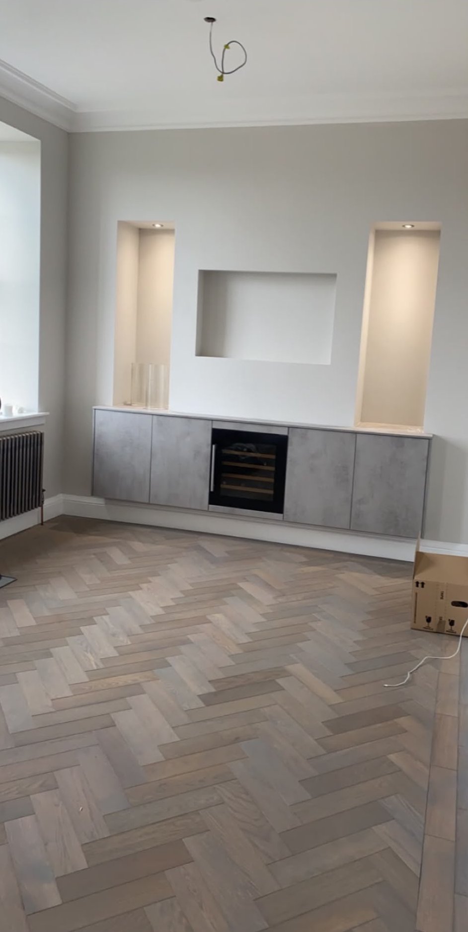 Plastered living room with a recessed fire and alcoves finished ready for decoration